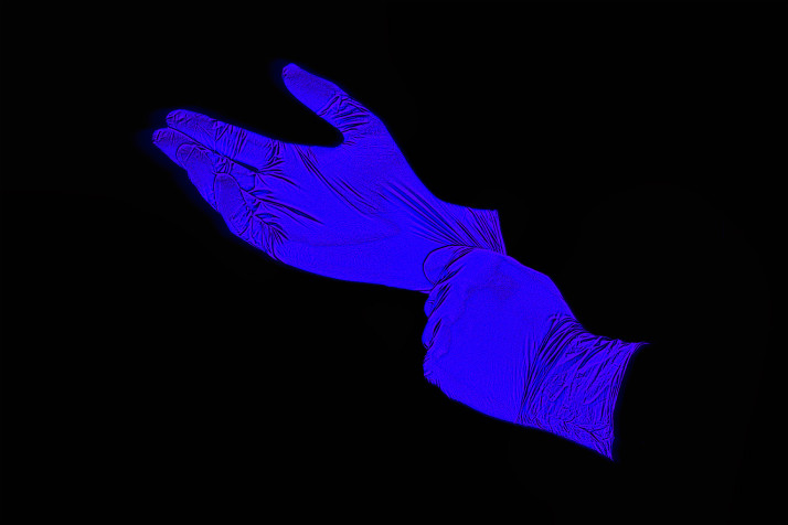 A stylized x-ray illustration of a pair of latex gloves