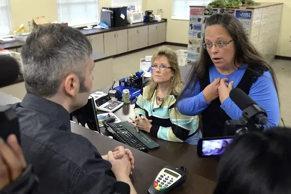 Rowan County, Kentucky, Clerk Kim Davis talks with David Moore following her office's refusal to issue marriage licenses at the Rowan County Courthouse in Morehead, Kentucky.